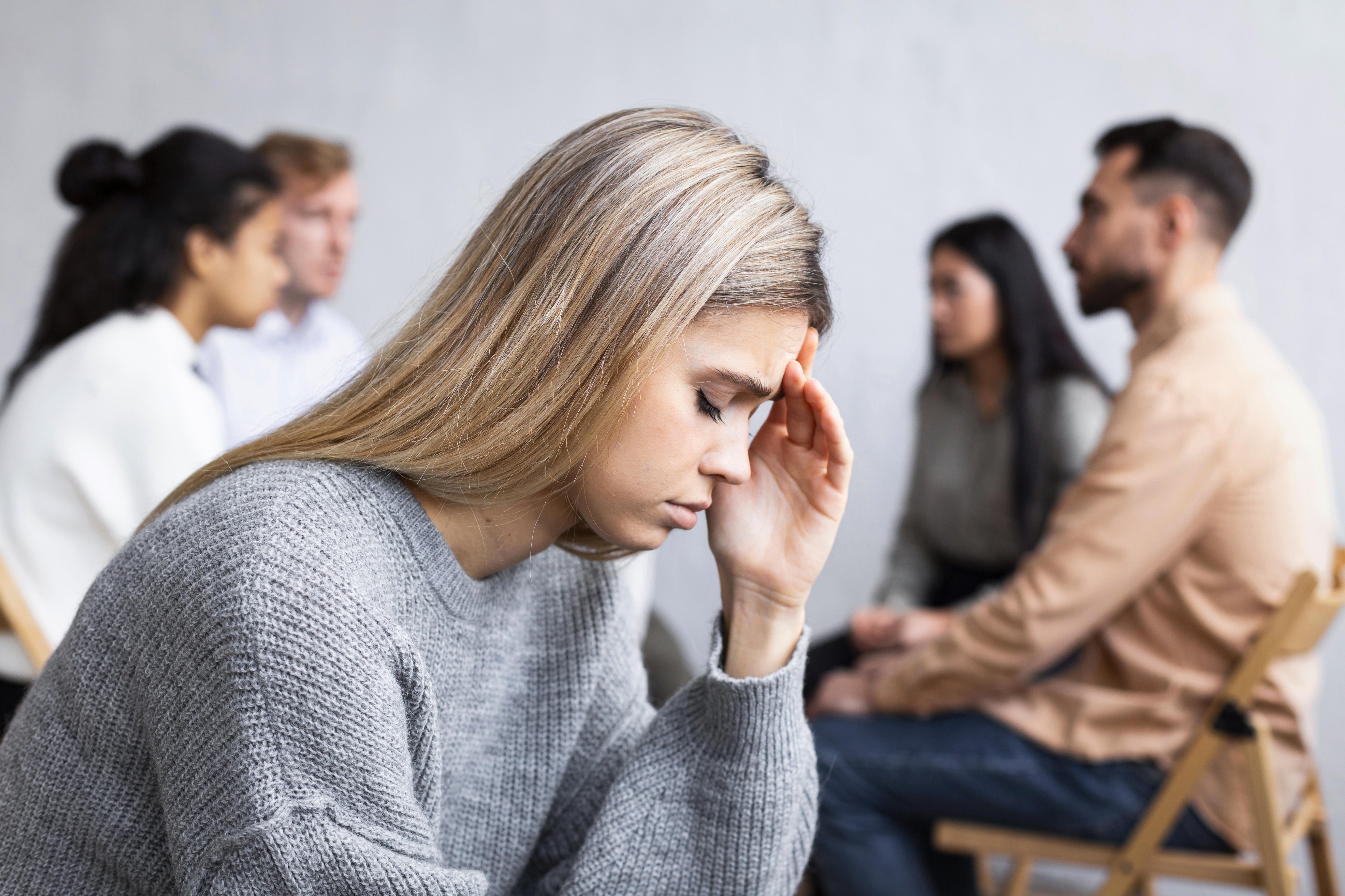 side-view-sad-woman-group-therapy-sessionjpg