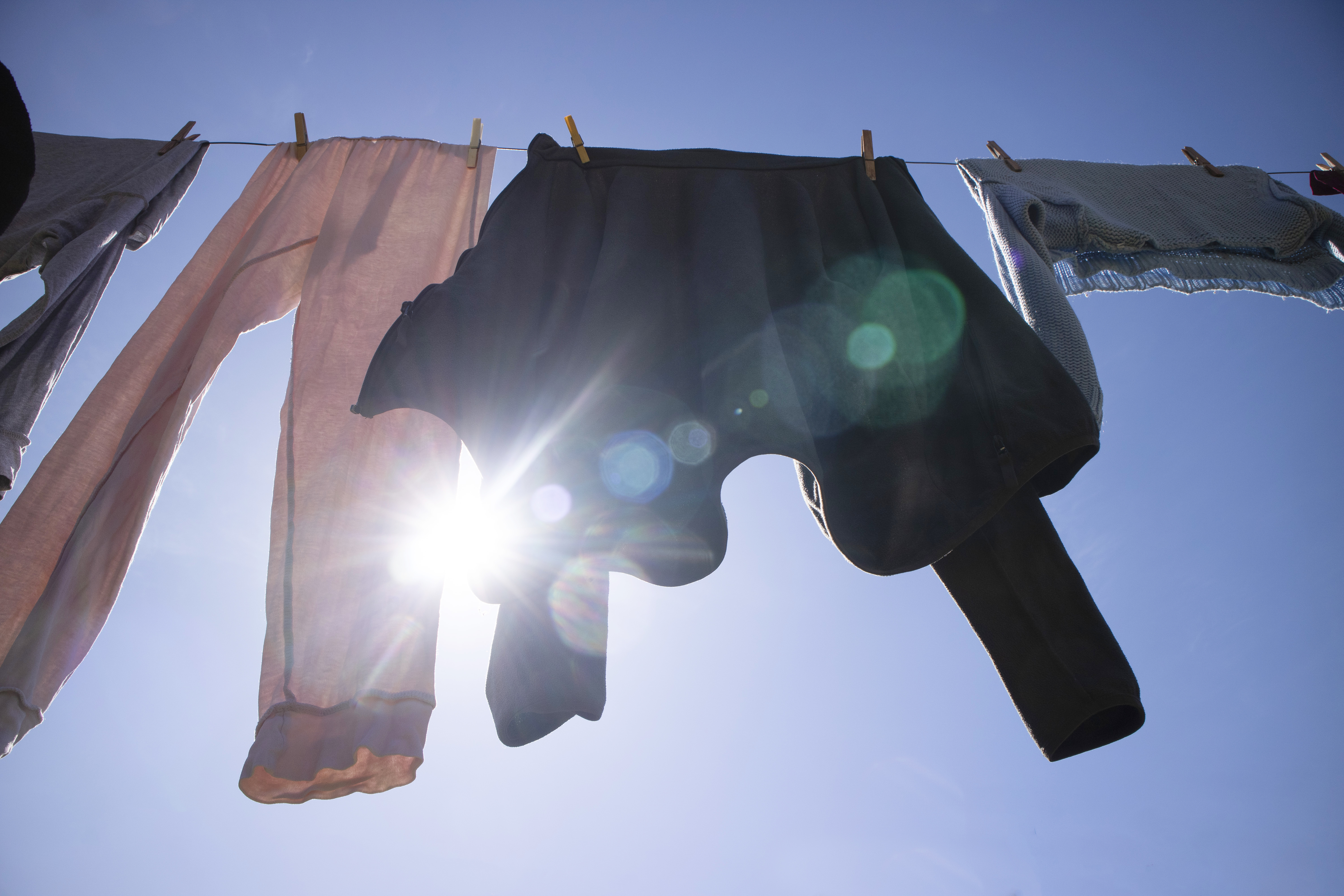 vecteezy_laundry-hanging-out-in-the-sun_27089212jpg